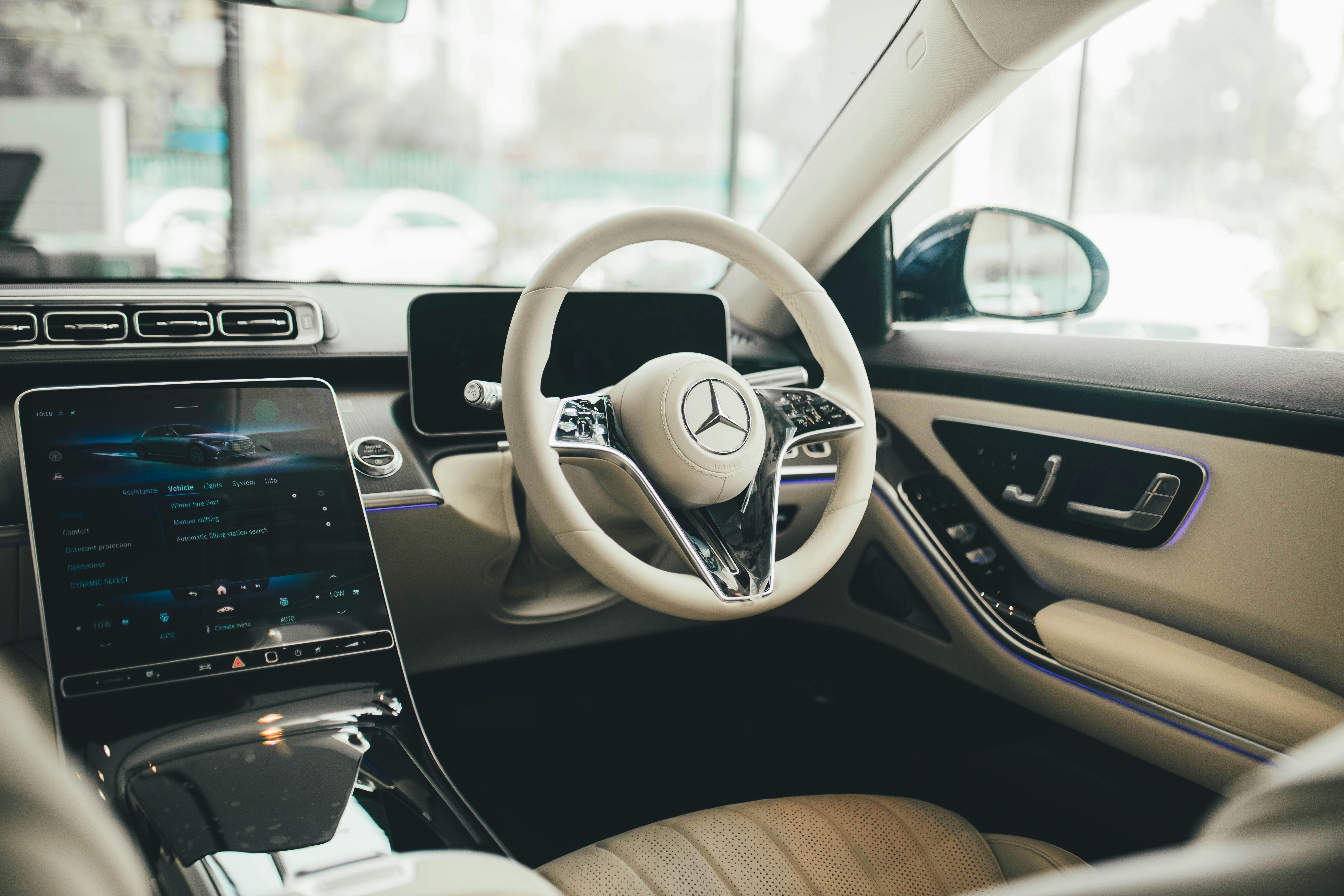 Image of a car interior, showing a touch screen user interface